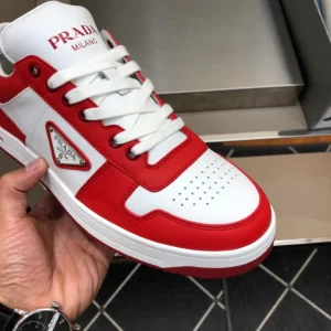 PRADA DOWNTOWN LEATHER SNEAKERS IN WHITE AND LACQUER RED- PRD012