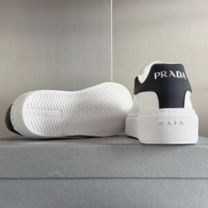 PRADA MACRO RE-NYLON AND BRUSHED LEATHER SNEAKERS - PRD065